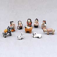 A miniature polychrome Nativity set with 11 pieces
 by Thomas Natseway of Laguna