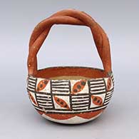 Polychrome basket with braided handle and geometric design
 by Unknown of Isleta