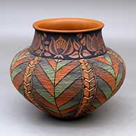 A polychrome tiny coil jar with a short neck decorated with a leaf and geometric design, a flared rim and decorated below the neck with a locks and keys geometric design on the tiny coils
 by Richard Zane Smith of Wyandot