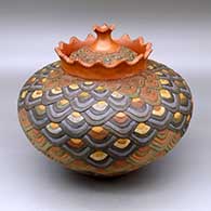 A polychrome lidded lazy coil jar with a crowned rim and decorated with a geometric design
 by Jamie Zane Smith of Wyandot
