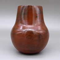 Red jar with a pine pitch coating and fire clouds, click or tap to see a larger version