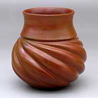 A brown melon jar with fire clouds and nine repousse ribs
 by Samuel Manymules of Dineh