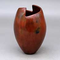 A polished brown jar with a geometric cut opening and decorated with fire clouds
 by Alice Cling of Dineh