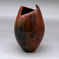 A polished brown jar with a geometric cut opening and decorated with fire clouds
 by Alice Cling of Dineh