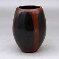 A polished brown jar decorated with fire clouds
 by Alice Cling of Dineh