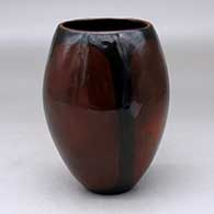 A polished brown vase decorated with fire clouds
 by Alice Cling of Dineh
