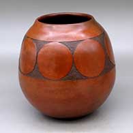 A brown jar decorated with fire clouds and a band of sgraffito geometric design
 by Sue Williams of Dineh