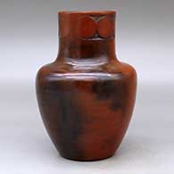 A polished brown jar with fire clouds decorated around the neck with a sgraffito geometric design, click or tap to see a larger version