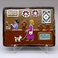 A polychrome tile decorated with a Dineh trading post design
 by Elizabeth Manygoats of Dineh