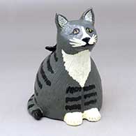 A polychrome cat figure with a butterfly on its back
 by Elizabeth Manygoats of Dineh