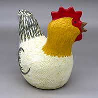 A polychrome sitting chicken figure
 by Elizabeth Manygoats of Dineh