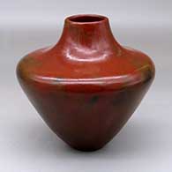 A brown jar with a narrow base, wide shoulder and short neck, and decorated with fire clouds
 by Alice Cling of Dineh