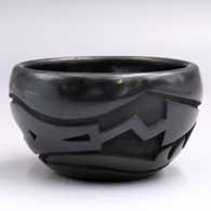 Small black bowl carved with an avanyu and geometric design and polished inside
 by Sherry Tafoya of Santa Clara