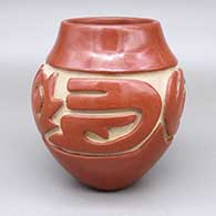 Red jar with a carved geometric design
 by Teresita Naranjo of Santa Clara