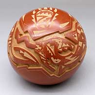 A red and micaceous golden seed pot carved with an avanyu, bear paw and geometric design
 by Sammy Naranjo of Santa Clara