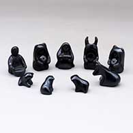 A black on black nativity set with 13 pieces
 by Linda Askan of Santa Clara