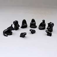 A miniature black on black Dineh-influence 13 piece nativity set
 by Linda Askan of Santa Clara