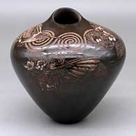 A dark brown high shouldered jar with an organic opening and decorated around the shoulder with a sgraffito hummingbird, nest, flower, branch, leaf and spiral geometric design
 by Johnathan Naranjo of Santa Clara