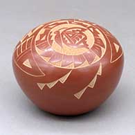 A red seed pot decorated with a sgraffito butterfly, hummingbird and geometric design
 by Candelaria Suazo of Santa Clara