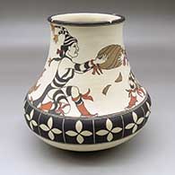 A classic polychrome Tewa jar decorated with a koshare, melon and geometric design
 by Lois Gutierrez of Santa Clara