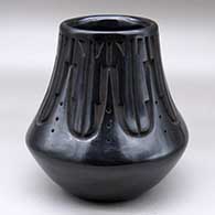 A tall neck black jar decorated with a carved kiva step and geometric design around the neck
 by Chris Martinez of Santa Clara