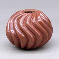 A red melon jar carved with 16 ribs
 by Nancy Youngblood of Santa Clara