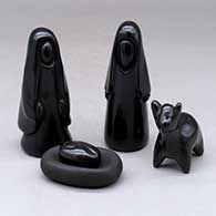 A five piece polished and matte black Nativity set
 by Joe Naranjo of Santa Clara