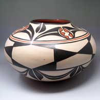 Polychrome jar with fish design inside, geometric design outside
 by Robert Tenorio of Santo Domingo