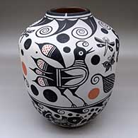 A polychrome jar decorated with a bird, dragonfly, fish, plant and geometric design
 by Thomas Tenorio of Santo Domingo