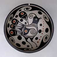 A polychrome chili bowl decorated with a bird and water symbol geometric design inside, and a water symbol geometric design outside
 by Thomas Tenorio of Santo Domingo