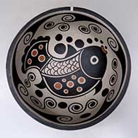 A polychrome chili bowl decorated with a fish and water symbol design inside, and a water symbol design outside
 by Thomas Tenorio of Santo Domingo