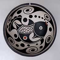A polychrome chili bowl decorated with a fish and water symbol geometric design inside, and a water symbol geometric design outside
 by Thomas Tenorio of Santo Domingo