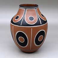 A polychrome jar decorated with bands of geometric design
 by Thomas Tenorio of Santo Domingo