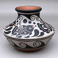 A low shouldered polychrome jar with a flared rim and decorated with a four panel fish, spiral and geometric design
 by Thomas Tenorio of Santo Domingo