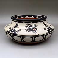 A large, wide polychrome bowl with a recurved neck and decorated inside and out with a bird and geometric design
 by Thomas Tenorio of Santo Domingo