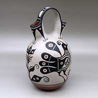 A polychrome wedding vase decorated with a four panel bird, plant and geometric design
 by Thomas Tenorio of Santo Domingo