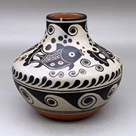 A polychrome jar with a recurved neck and decorated with a fish, water wave, bubble and geometric design
 by Thomas Tenorio of Santo Domingo