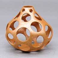 A gourd shaped golden micaceous holey jar
 by Hubert Candelario of San Felipe