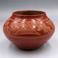 Red-on-red jar with a 4-panel geometric design, painted by her husband, Juan Cruz Roybal
 by Tonita Roybal of San Ildefonso