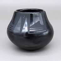 Small black-on-black jar with a geometric design
 by Maria Martinez of San Ildefonso