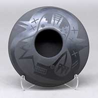 A black on black bowl decorated with an avanyu and pueblo design above the shoulder
 by Marvin and Frances Martinez of San Ildefonso
