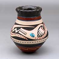 A polychrome jar with a pie crust rim and decorated with a sgraffito and slipped avanyu and geometric design plus inlaid stones and bands of hematite beads
 by Russell Sanchez of San Ildefonso