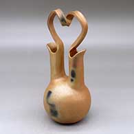 A golden micaceous wedding vase with fire clouds and a looped bridge
 by Eric Marcus of Taos