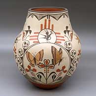 A polychrome jar decorated with a four panel butterfly, bird, flower and geometric design
 by Marcellus Medina of Zia