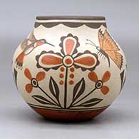 A small polychrome jar decorated with a two panel hummingbird, butterfly, flower and geometric design, click or tap to see a larger version