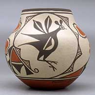A small polychrome jar decorated with a four panel roadrunner, sunflower, rainbird and geometric design, click or tap to see a larger version