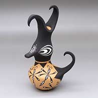 A small polychrome duck pot decorated with a dragonfly and geometric design
 by Anderson Jamie Peynetsa of Zuni