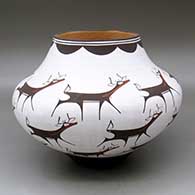 A polychrome jar decorated with a deer-with-heart-line and geometric design
 by Anderson Peynetsa of Zuni