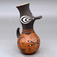 A polychrome duck effigy pot decorated with a dragonfly, tadpole and geometric design
 by Anderson Jamie Peynetsa of Zuni