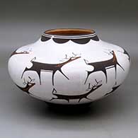 A polychrome jar decorated with a deer-with-heart-line and geometric design
 by Anderson Peynetsa of Zuni